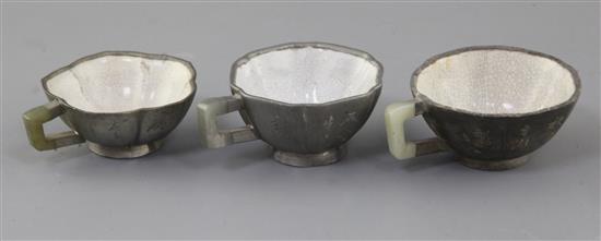 Three Chinese Yixing pewter and jade mounted cups, Daoguang period (1821-50), w. 8cm-8.6cm